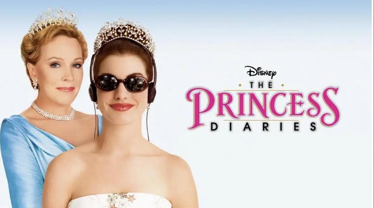 Promotional artwork for The Princess Diaries, released in 2001, features two women wearing tiaras alongside the film’s title. (Photo via Walt Disney Pictures)