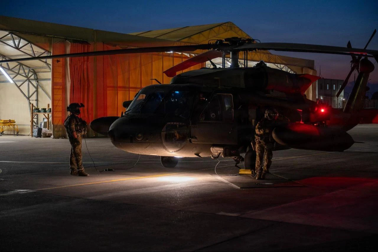 U.S. Army soldiers conduct pre-flight checks on a UH-60 Black Hawk before routine night flight operations at Incirlik Air Base, Türkiye, July 31, 2026. (Photo via U.S. Air Force)