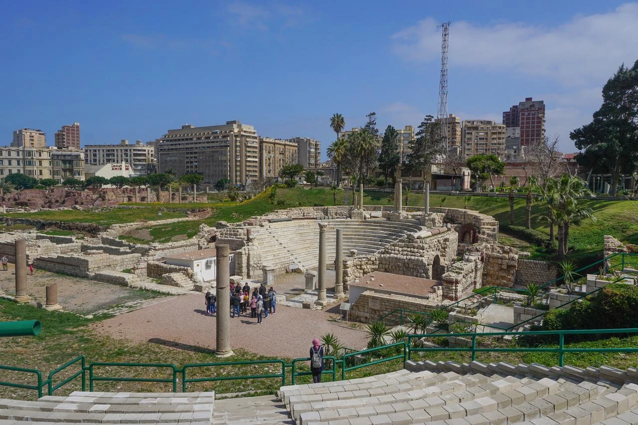 Visitors explore the Roman Theater at the Kom el-Dikka archaeological site in Alexandria, Egypt. (Adobe Stock Photo)
