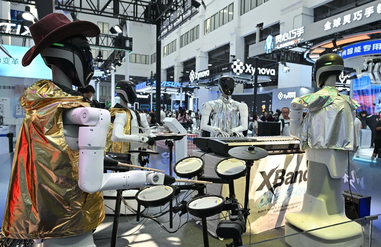 A robot band from UniX AI plays music during the 2026 World Robot Conference in Beijing on August 19, 2026. (AFP Photo)