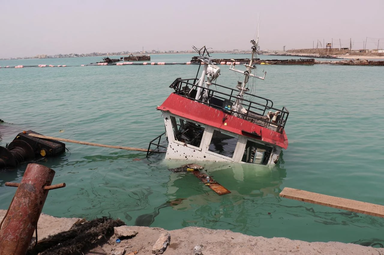 The navigation bridge of a sunken vessel is all that is seen at the surface of the water in the Port of Mokha the day after an attack by the Houthis on the city Mokha, held by Yemen's internationally recognised, Aden-based government on August 10, 2026. (AFP Photo)