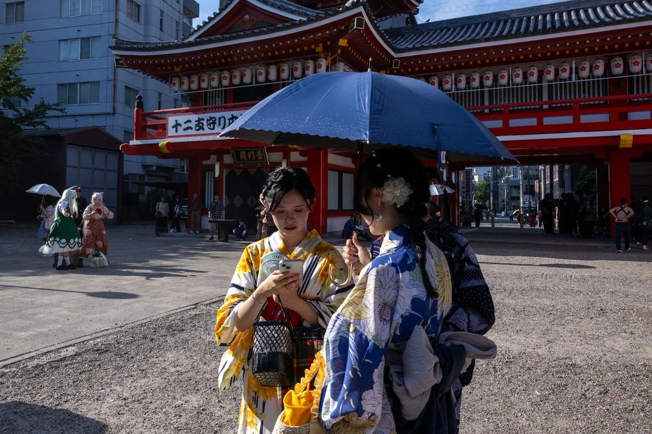 Japanese companies cut hours, cosplay summit moves dates as heat intensifies