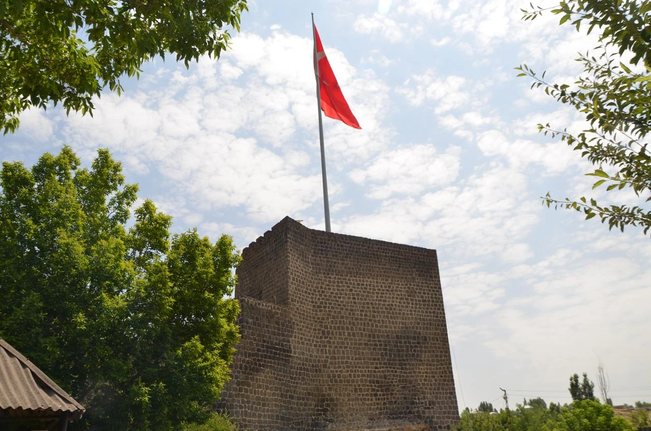 Facade of Malazgirt Castle with Turkish flag on top of it. (AA Photo)
