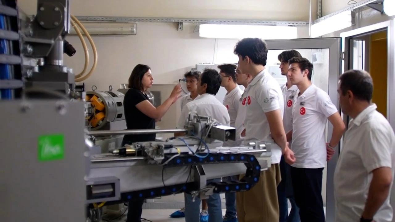 Turkish students listen to an instructor during preparations for the International Nuclear Science Olympiad at a laboratory in Türkiye, Aug. 1, 2026. (AA Photo)