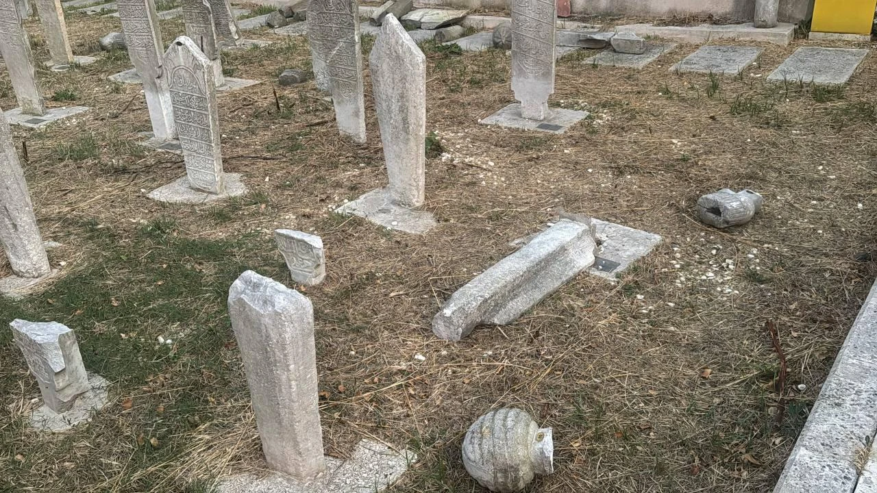 Broken gravestones are seen scattered across a historic cemetery after seven markers were damaged in Fatih, Istanbul, Türkiye, Aug. 2, 2026. (AA Photo)