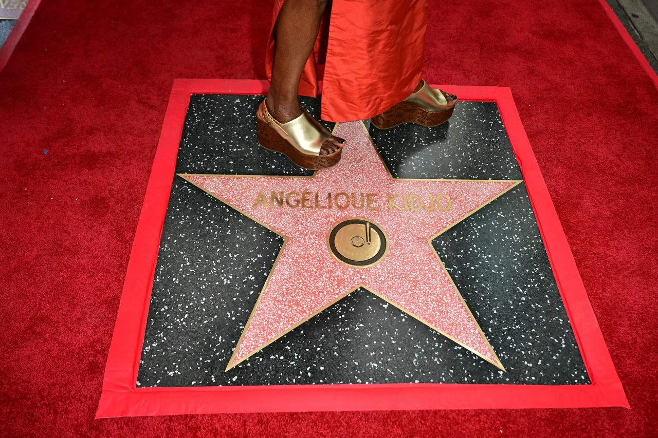 Beninese musician and actress Angelique Kidjo stands on her newly unveiled star during her Hollywood Walk of Fame star ceremony in the Hollywood neighborhood of Los Angeles on August 18, 2026. (AFP Photo)
