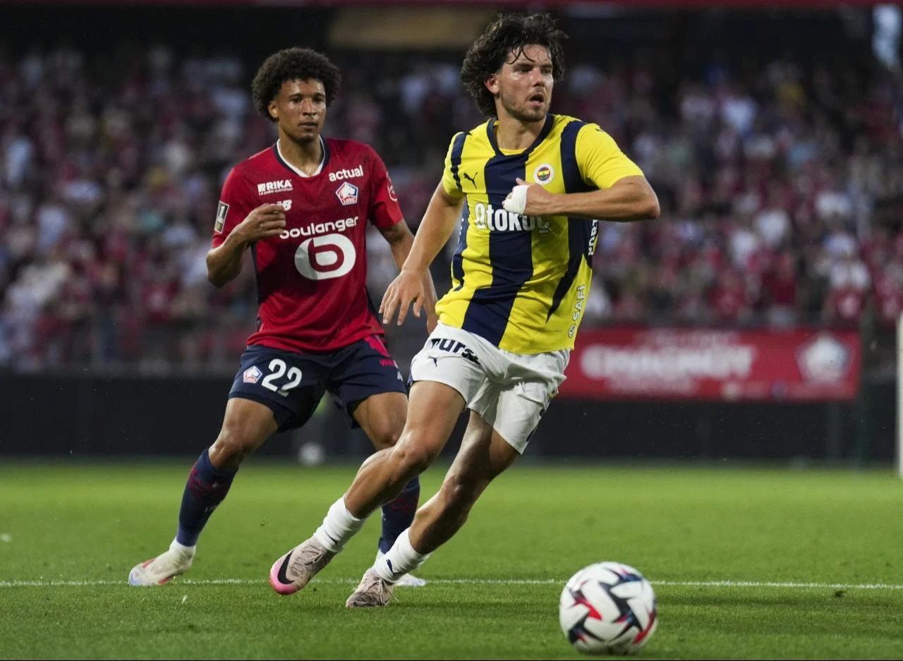 Ferdi Kadioglu (R) of Fenerbahce in action against Tiago Santos (L) of Lille during UEFA Champions League 3rd qualifying match between Lille and Fenerbahce, France on August 6, 2024. (AA Photo)
