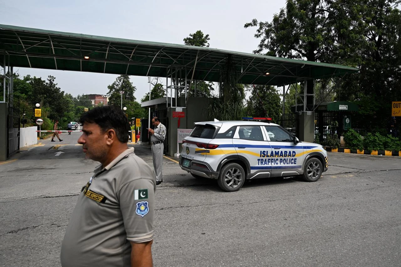 Traffic police personnel stand outside the Shifa International Hospital in Islamabad on August 18, 2026, after Pakistan's Supreme Court ordered jailed former prime minister Imran Khan's transfer from prison for medical treatment. (AFP Photo)