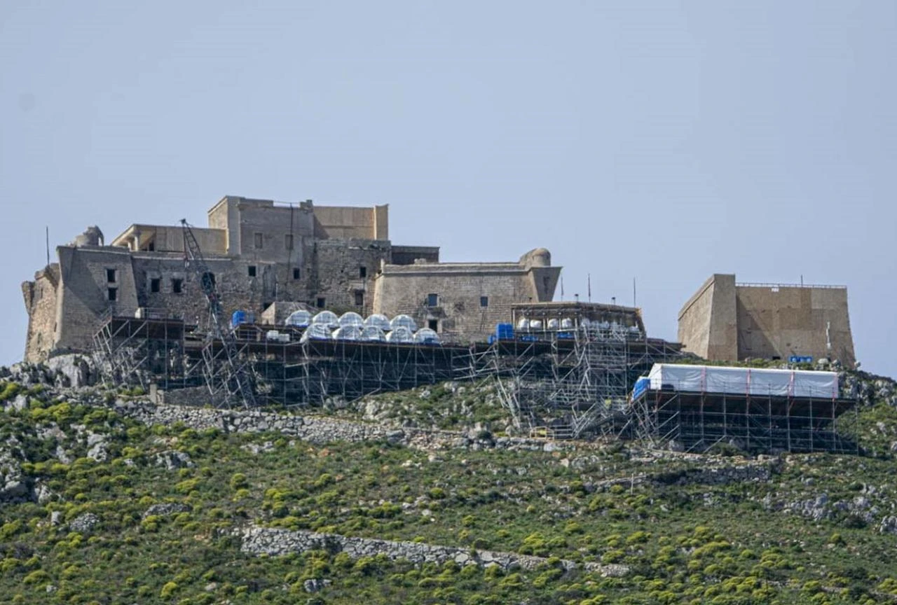 A full-scale ship used during filming for Christopher Nolan's The Odyssey is seen at the harbor in Favignana, Sicily. (Photo via The Introvert Traveler)