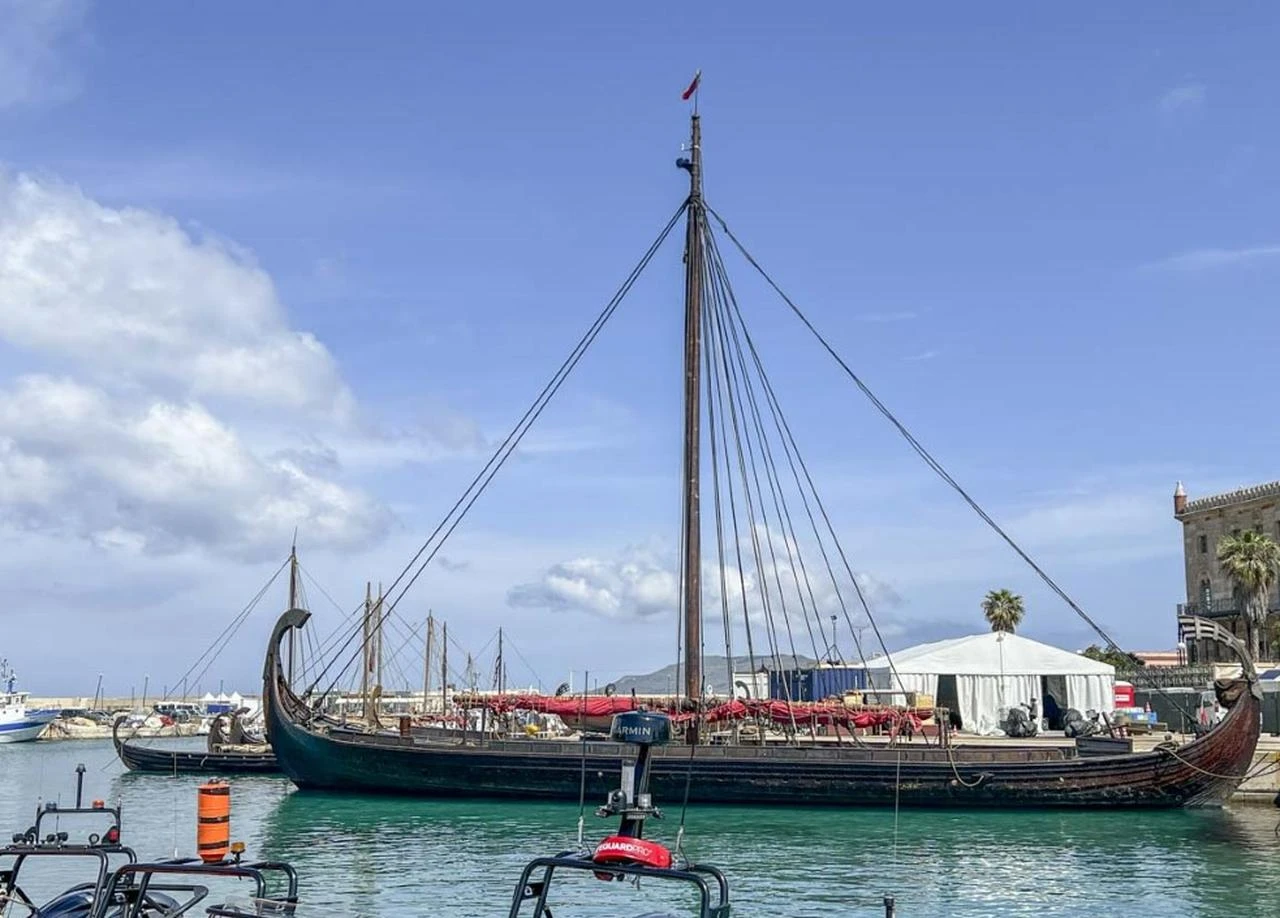 A replica ancient Greek-style ship used during filming for Christopher Nolan’s The Odyssey is seen docked at Favignana, Sicily. (Photo via The Introvert Traveler)