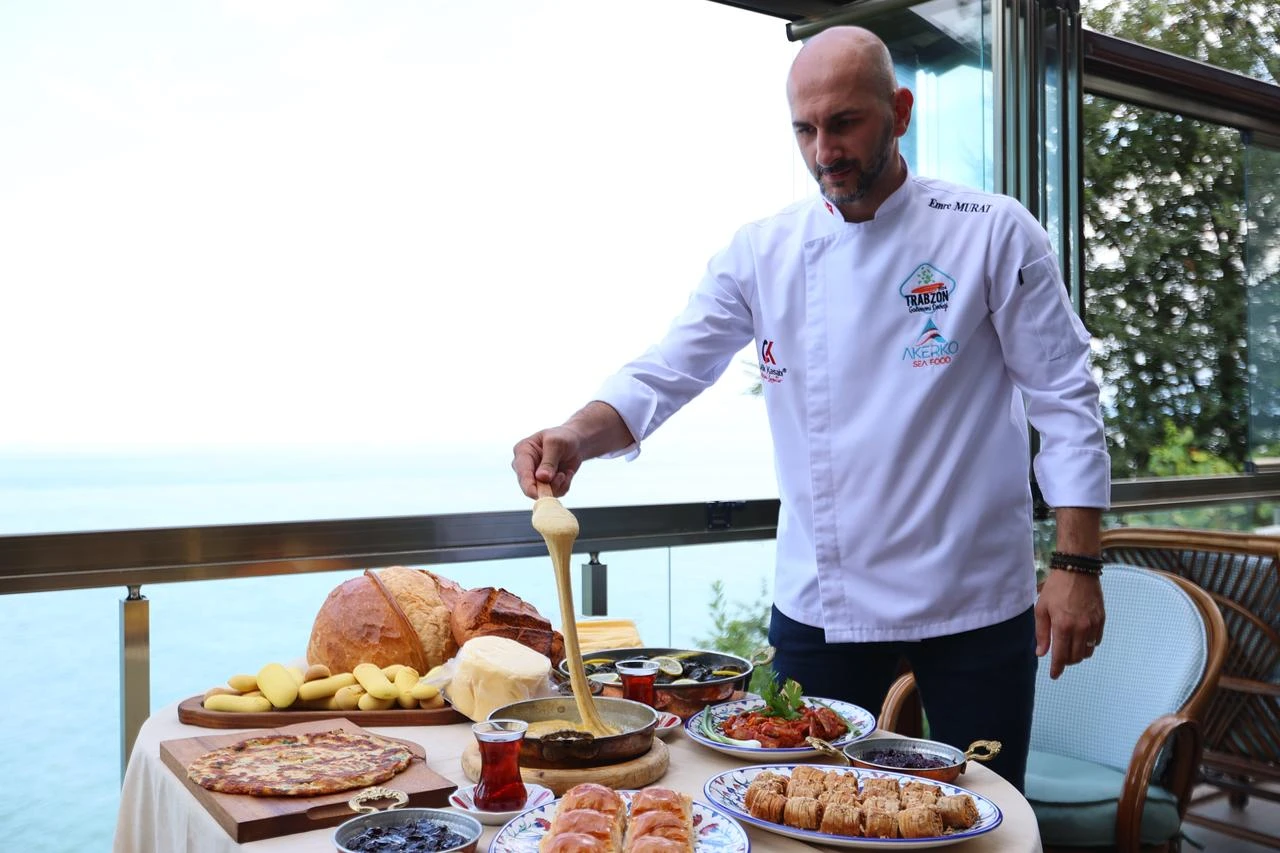 Emre Murat, president of the Trabzon Gastronomy Association, displaying traditional Trabzon dishes. (AA Photo)