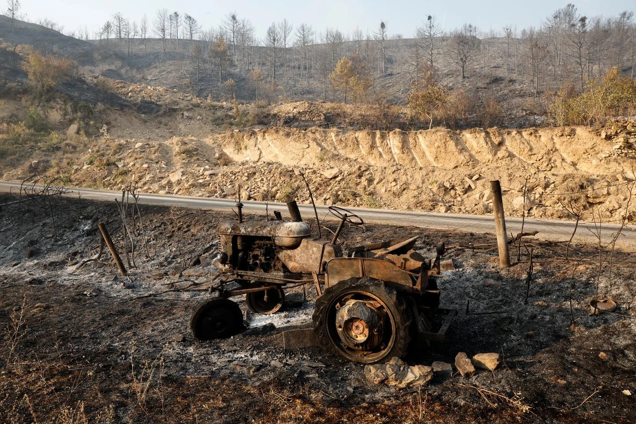 Burnt tractor in Santa Cruz de la Seros, in the Spanish northeastern province of Aragon, amid a wildfire that burnt 16,600 hectares. (AFP Photo)