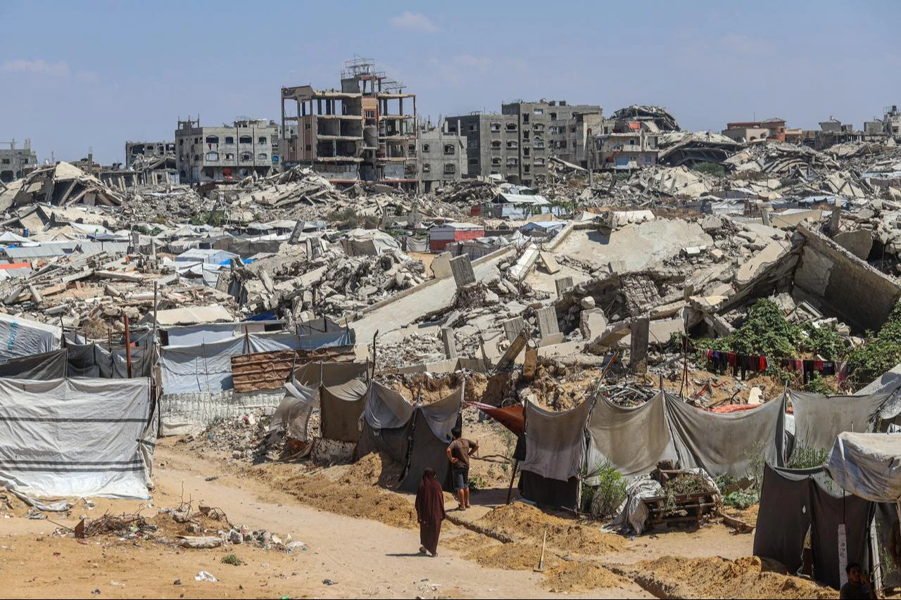 Displaced Palestinian families try to survive under harsh living conditions among the rubble of damaged and destroyed buildings in Beit Lahia, in the northern Gaza Strip, Palestine, Aug. 18, 2026. (AA Photo)