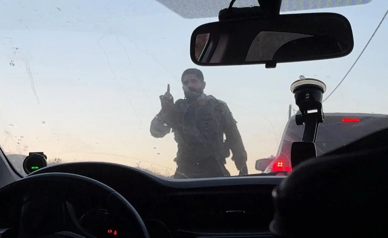Israeli forces block Palestinian-American Loui Ridi as he approaches his family home by vehicle, which is under siege by Israeli settlers, in the town of Qusra, south of Nablus in the West Bank, Palestine on August 17, 2026. (AA Photo)