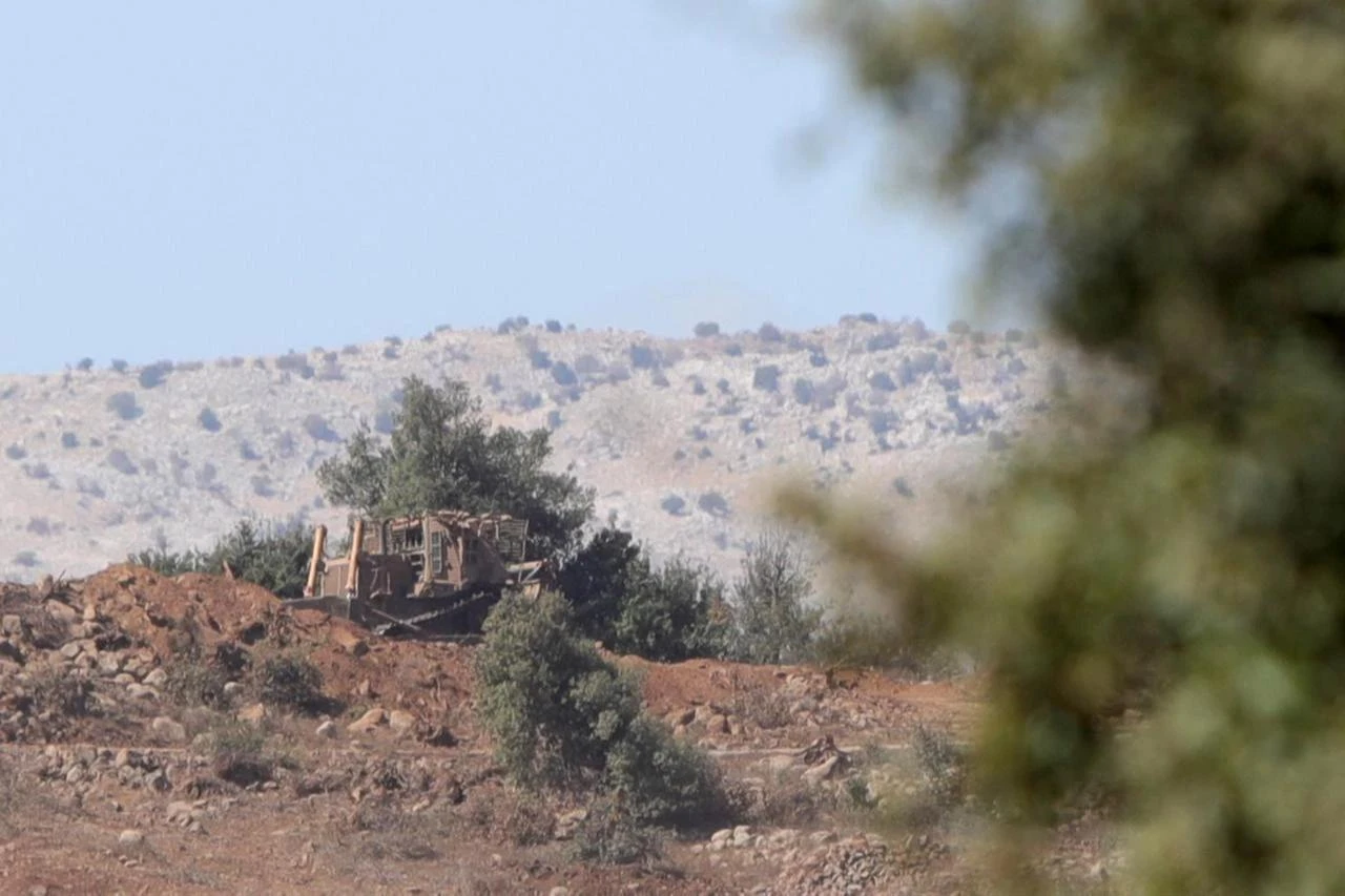 A view of the Israeli military posts established in the Quneitra region, along with the construction equipment used during these operations, seen from Quneitra, Syria, Oct. 20, 2025. (AA Photo)