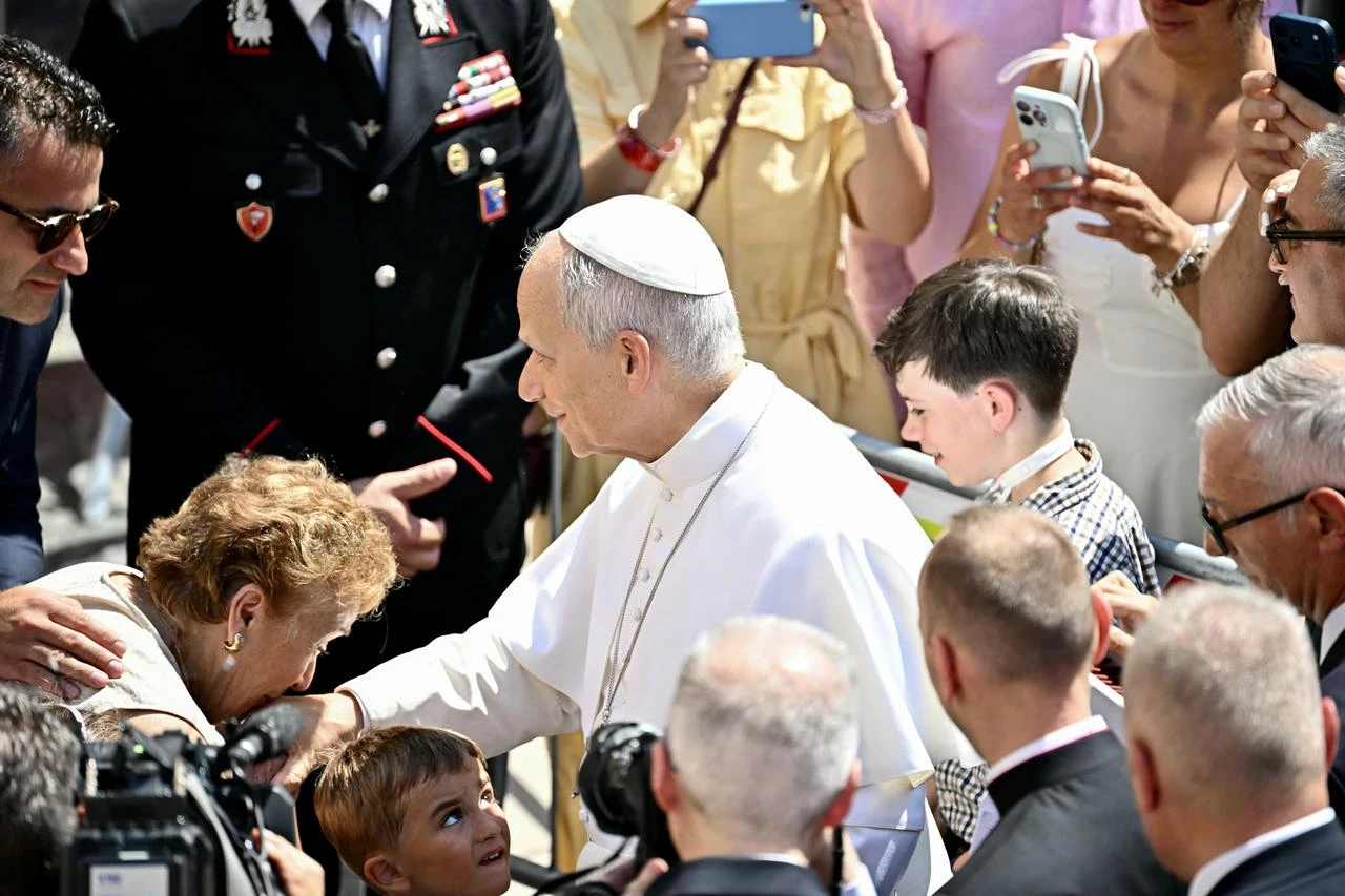 Pope Leo XIV greets faithful after the Angelus prayer in Castel Gandolfo, Italy, Aug. 15, 2026. (AFP Photo)