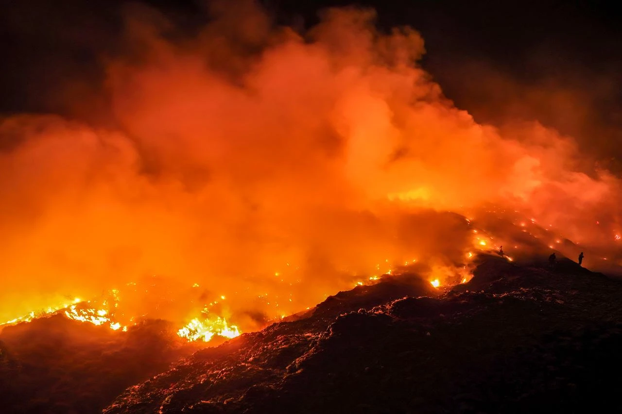 Picture taken on August 6, 2026 shows a fire burning at a landfill site in Rasau Jaya, Kubu Raya, West Kalimantan. (AFP Photo)