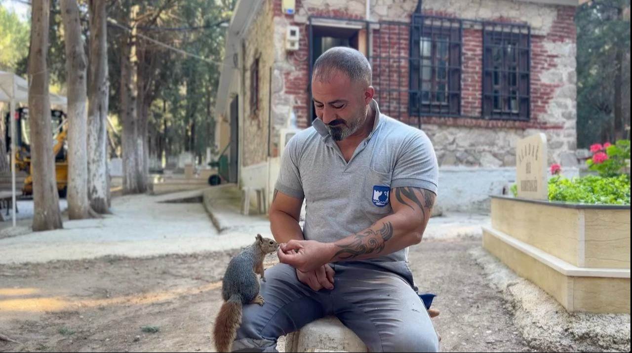 Baran Aladag with one of his squirrels. (AA Photo)