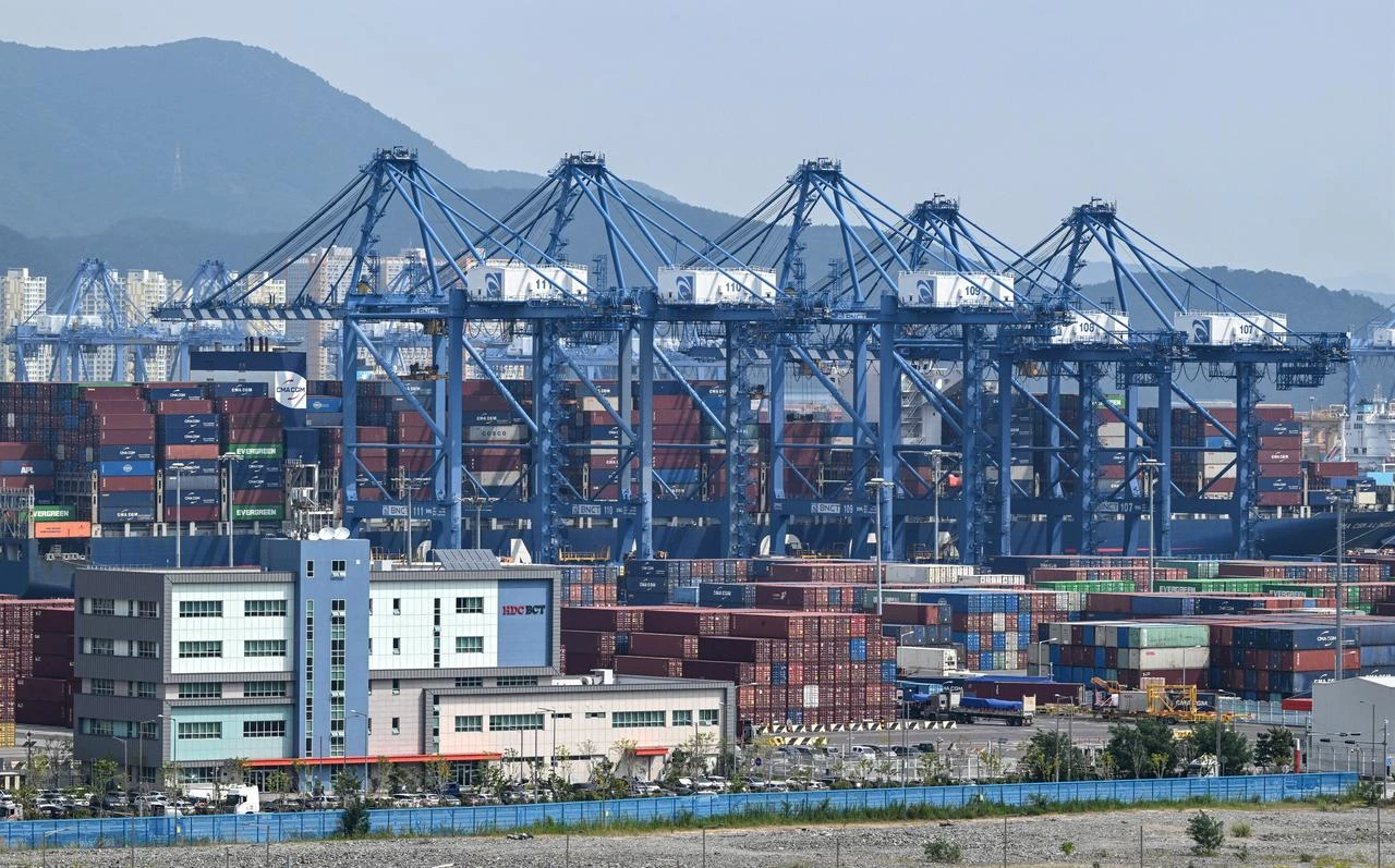 This general view shows shipping containers and cranes at Busan New Port in Busan, South Korea, August 22, 2026. (AFP Photo)
