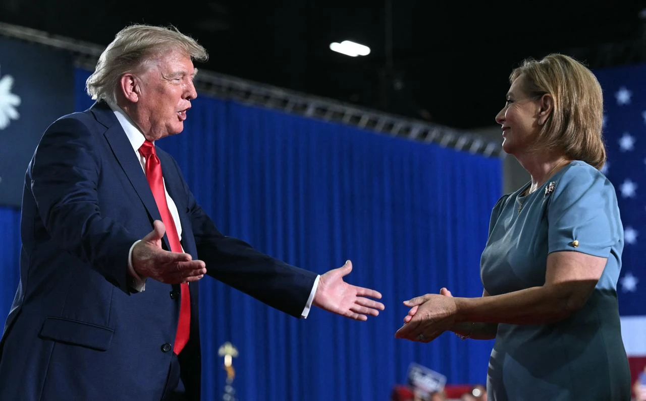 US President Donald Trump congratulates US Senator Darline Graham after she spoke during a campaign rally at Myrtle Beach Convention Center in Myrtle Beach, South Carolina on August 21, 2026. (AFP Photo)
