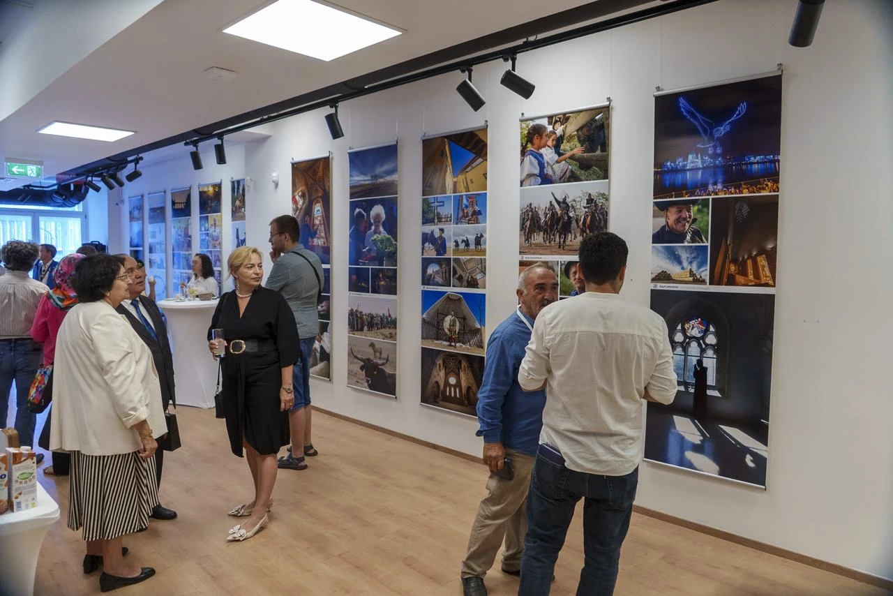 Visitors view photographs during the opening of the “20th TURKSOY Photographers’ Gathering” jubilee exhibition at the Budapest Art Bridge (BAB) Gallery in Budapest, Hungary, Aug. 22, 2026. (AA Photo)