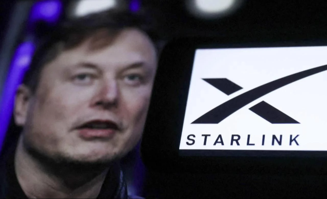 Elon Musk with the Starlink satellite logo in the background during an event, date and time undisclosed. (AFP Photo)
