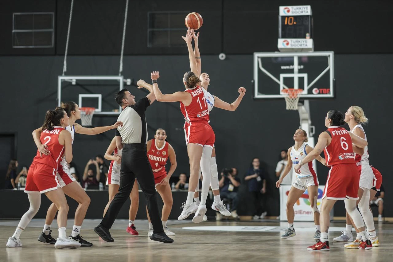 Elif Bayram (11) of Turkiye battles for the ball during an international friendly basketball match as part of the FIBA Women's World Cup preparations at the Basketball Development Center in Istanbul, Turkiye, Aug. 23, 2026. (AA Photo)