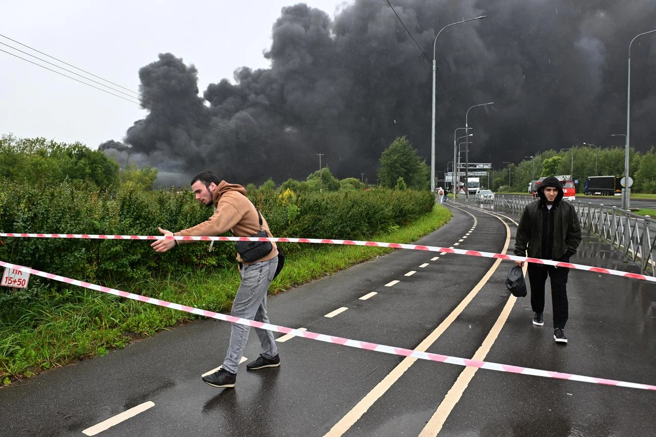 ST. PETERSBURG, RUSSIA - AUGUST 23: Thick black smoke rises after a fire breaks out at a logistics center in St. Petersburg, Russia, on August 23, 2026. (AA Photo)