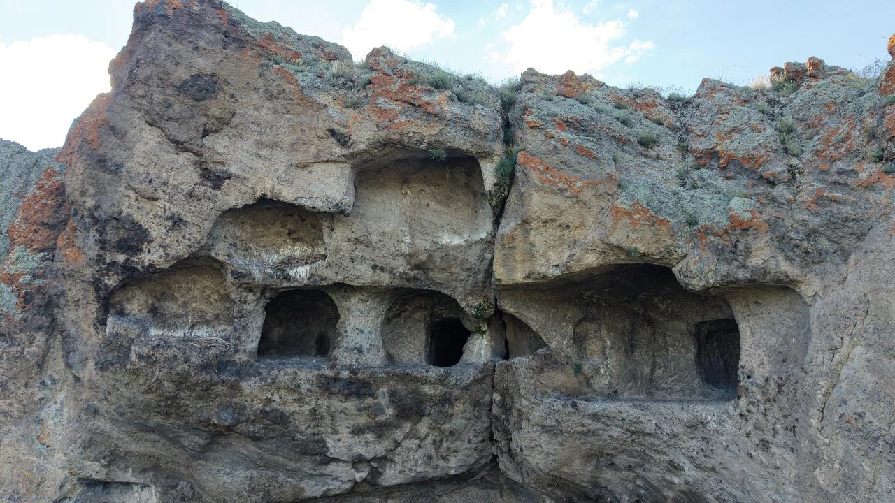 Interconnected rock-cut chambers at the registered Urartian-era Hamamderesi site are seen in Erzurum, Türkiye, Aug. 24, 2026. (AA Photo)
