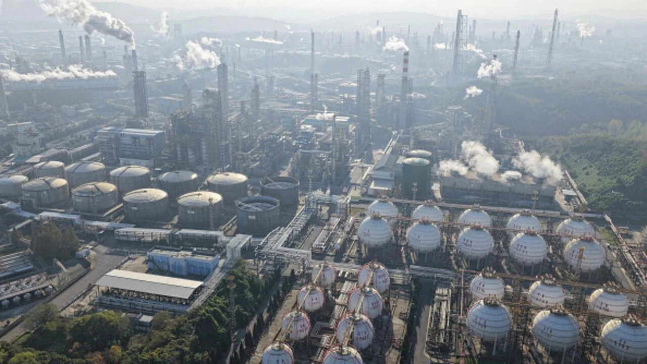 An aerial view shows a petrochemical plant in operation by the Yangtze River in Nanjing, in eastern China's Jiangsu province November 26, 2025. (AFP Photo)