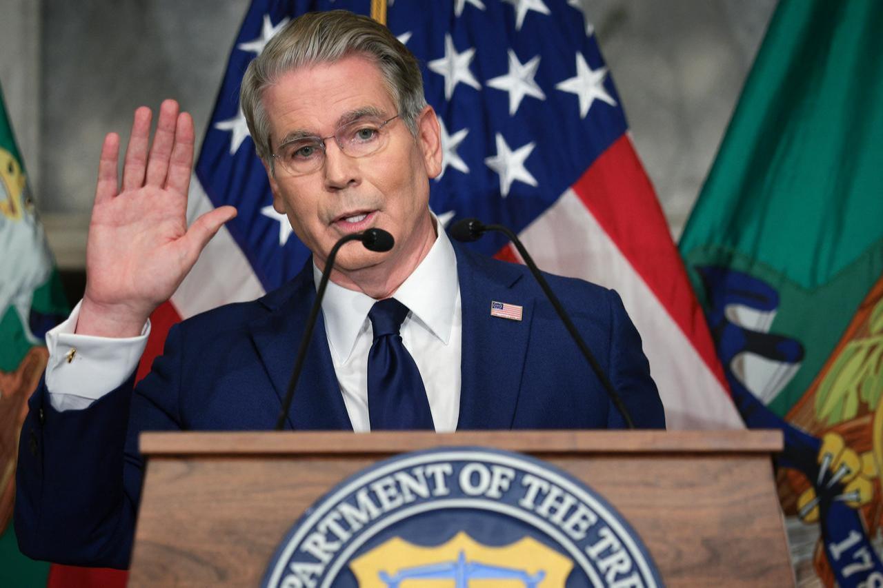 U.S. Treasury Secretary Scott Bessent waves goodbye to reporters after announcing a new set of sanctions against Iran, describing them as "an economic D-Day" in the Cash Room at the Treasury Department, August 24, 2026, in Washington, DC. (AFP Photo)