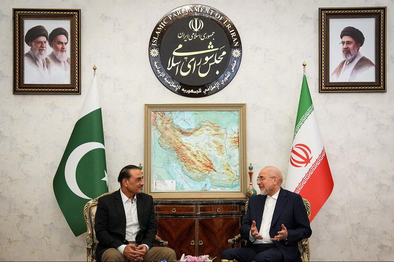 Speaker Mohammad Bagher Ghalibaf (R) receiving Pakistan's army chief Syed Asim Munir (L) in Tehran on August 24, 2026. (AFP Photo/HO/Islamic Consultative Assembly News Agency (ICANA))