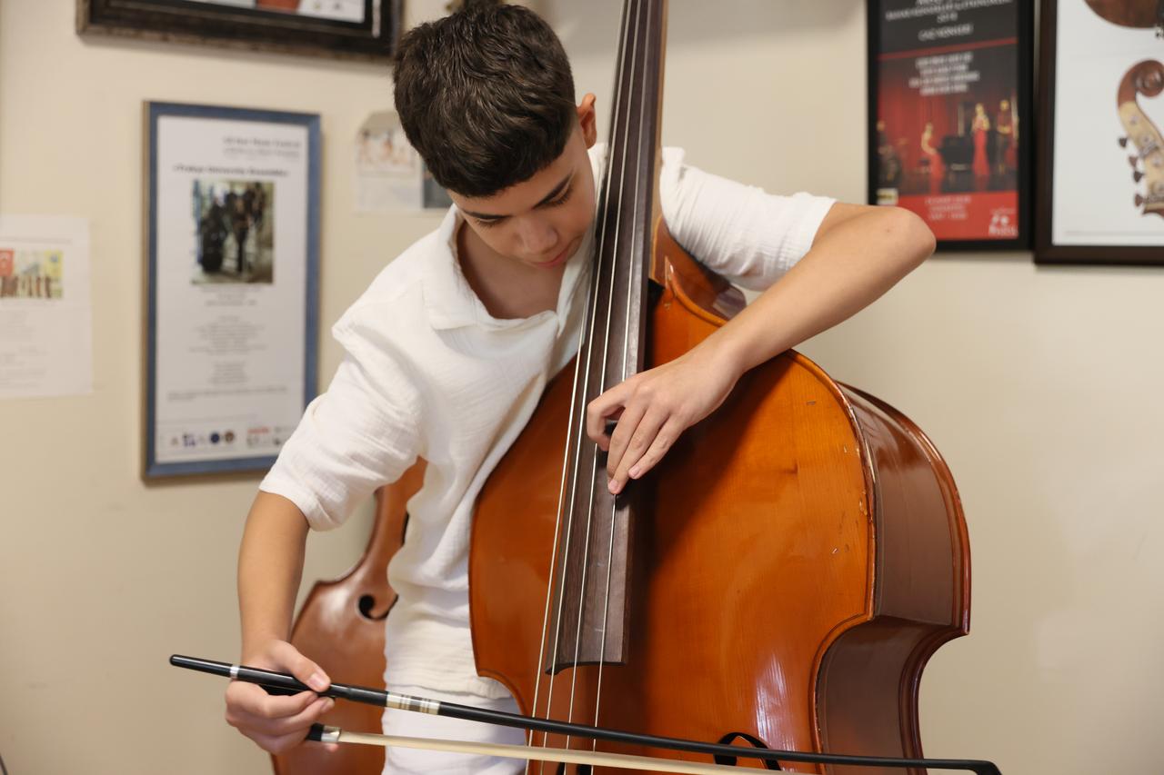 Ata Yalcinbas posing next to his double bass. (AA Photo)