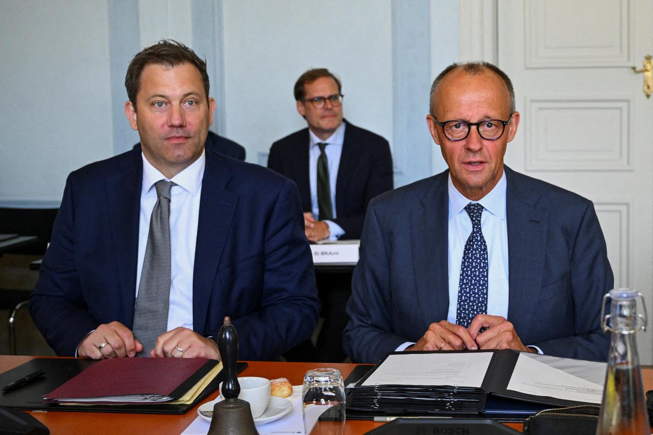 German Chancellor Friedrich Merz (R) and German Finance Minister and Vice Chancellor Lars Klingbeil attend a two-day retreat meeting of the German cabinet on August 26, 2026. (AFP Photo)