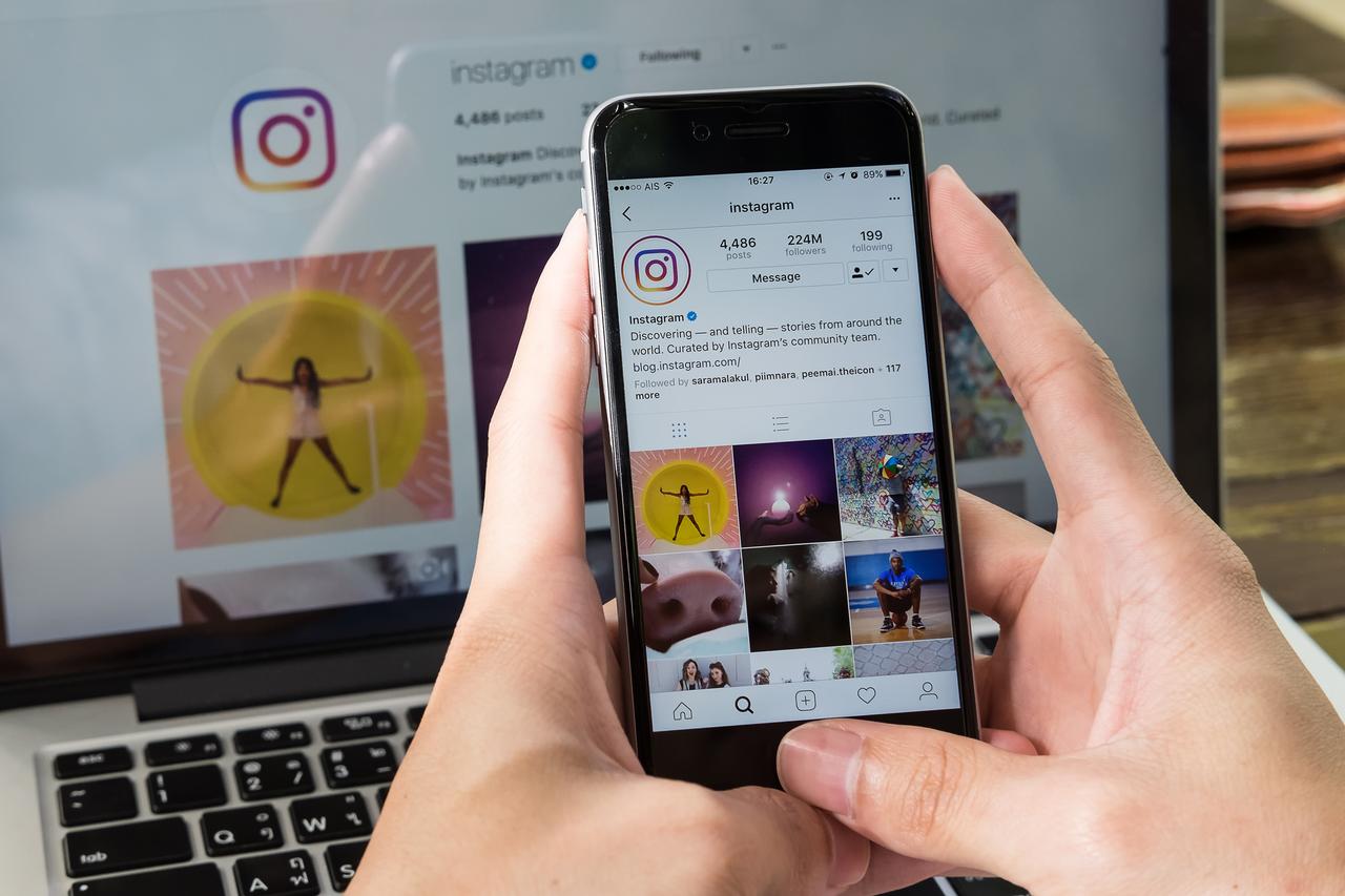 A man holds a smartphone displaying the Instagram app in Chiang Mai, Thailand, June 24, 2017. (Adobe Stock Photo)