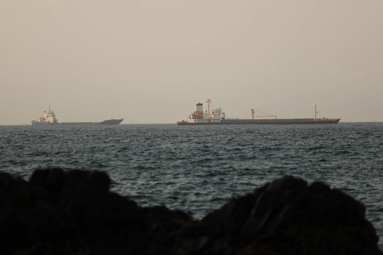 Commercial vessels and oil tankers preparing to transit through the Strait of Hormuz, one of the most critical strategic waterways for global trade flows, maintain their wait in the Gulf of Oman, June 17, 2026. (AA Photo)