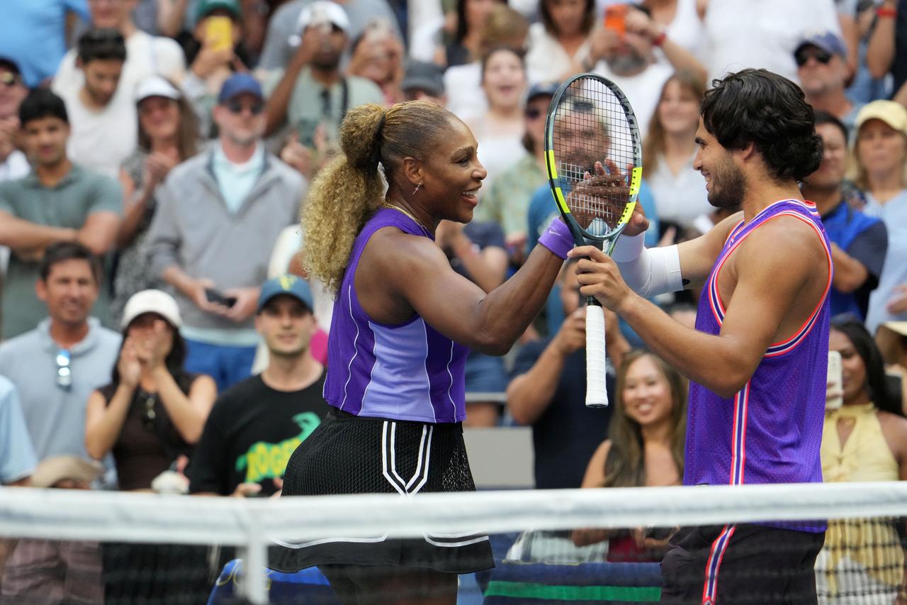 Serena Williams and Carlos Alcaraz react after winning their mixed doubles match against Erin Routliffe and Lloyd Glasspool at the 2026 US Open tennis tournament on August 25, 2026. (AFP Photo)