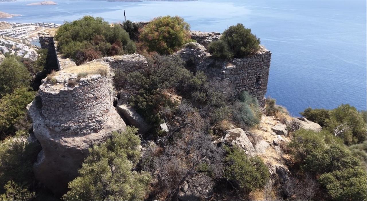 The stone walls and towers of historic Aspat Castle rise above the coast in Bodrum, Mugla, Türkiye, Aug. 27, 2026. (AA Photo)