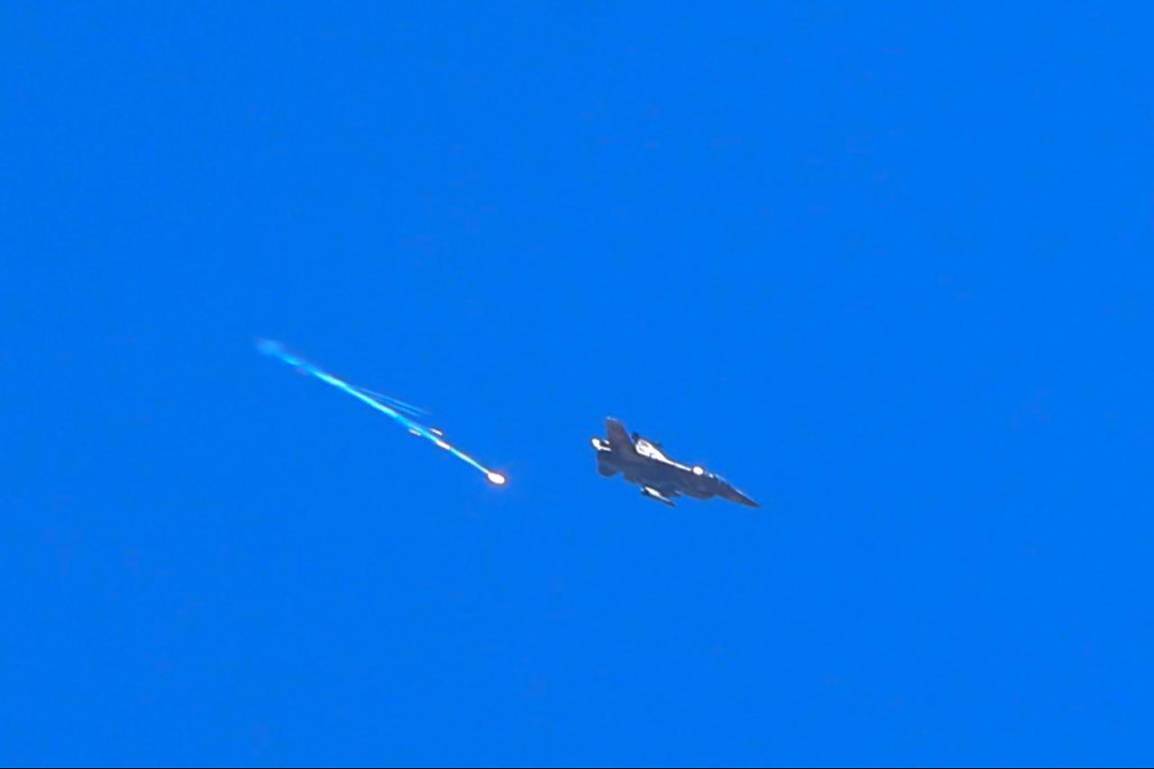 An Israeli fighter aircraft fires a flare as it flies over the predominantly Druze city of Sweida on July 15, 2025, following clashes between Bedouin tribes and Druze fighters. (AFP Photo)