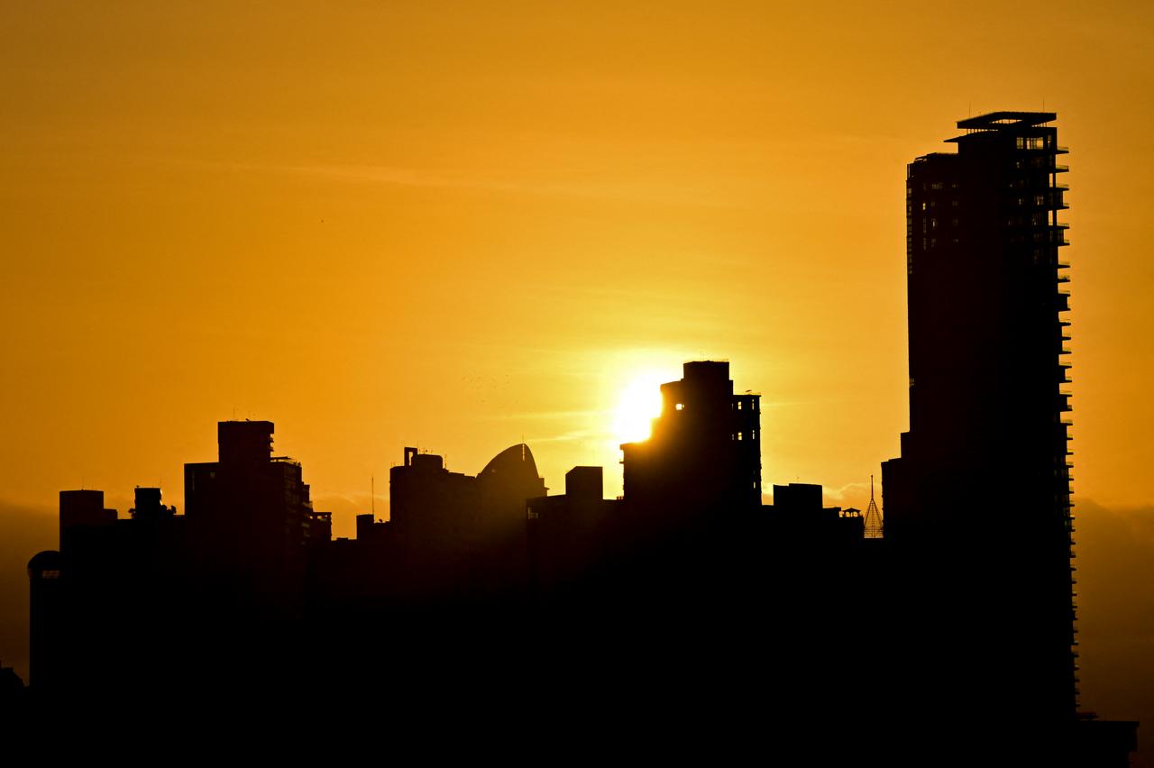 The sun sets behind the skyline of Panama City, Panama, Aug. 26, 2026. (AFP Photo)