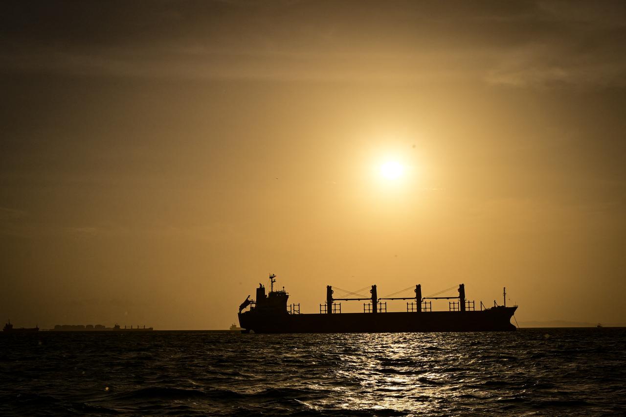 A cargo ship is silhouetted against the setting sun off Panama’s Pacific coast, Aug. 26, 2026. (AFP Photo)