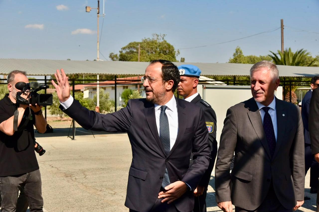 Greek Cypriot administration leader Nikos Christodoulides waves at the president of the Turkish Republic of Northern Cyprus (TRNC), Tufan Erhurman, after a meeting in the buffer zone, Aug. 26, 2026. (AA Photo)