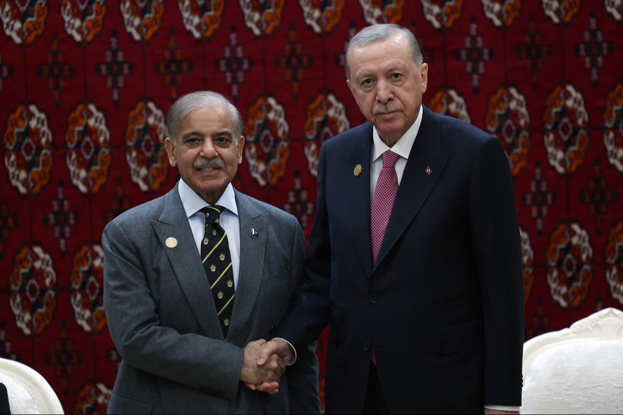 Turkish President Recep Tayyip Erdogan (R) receives Pakistani Prime Minister Shehbaz Sharif (L) as part of the International Peace and Security Forum in Ashgabat, Turkmenistan on Dec. 12, 2025. (AA Photo)