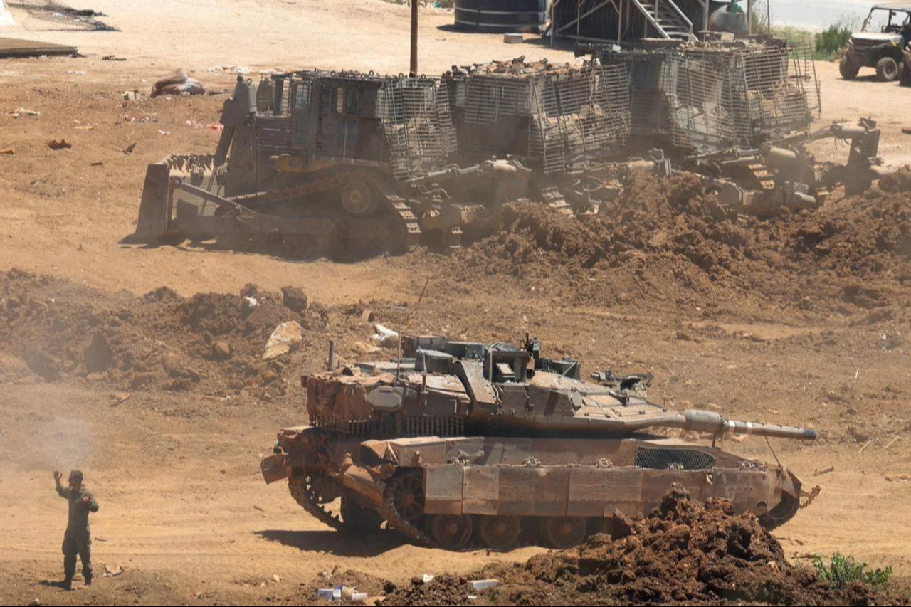 This picture taken from a position in the Upper Galilee in northern Israel shows an Israeli army tank being positioned along the Israel-Lebanon border, July 1, 2026. (AFP Photo)
