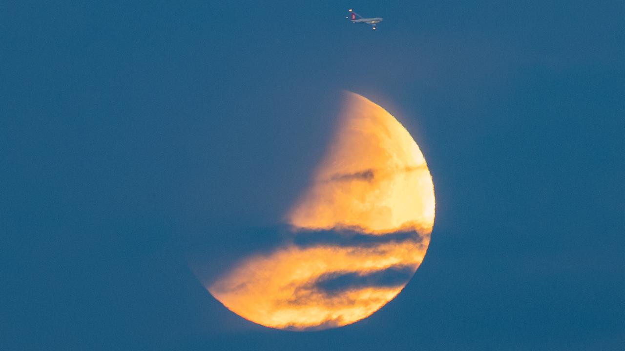 Istanbul's mosques and towers frame nearly total lunar eclipse