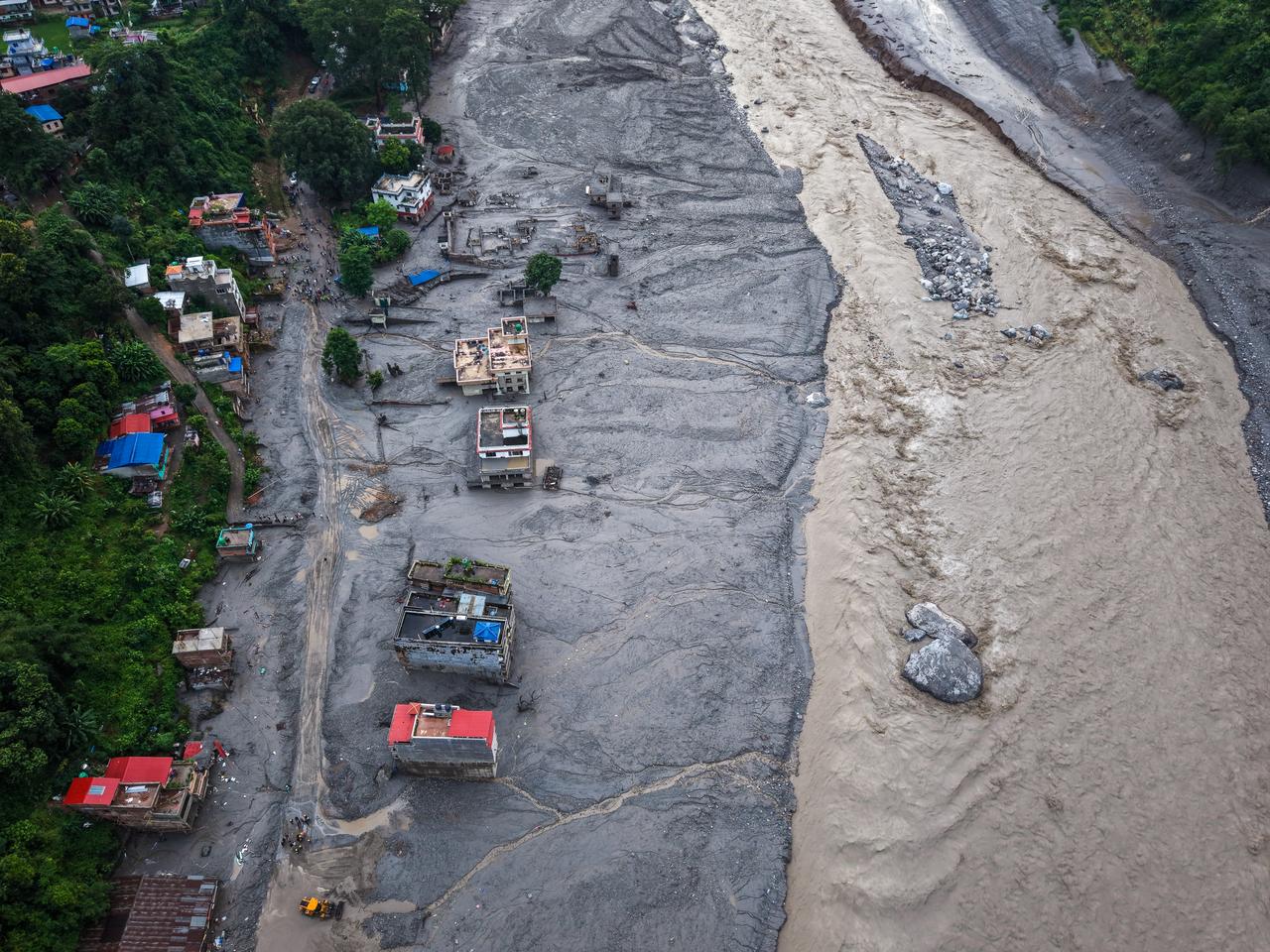 An aerial view of destroyed houses and roads covered in muds along the Trishuli River, following landslide and flash floods in areas near the Nepal-China border, in Nuwakot, Nepal, on August 28, 2026. (AA Photo)