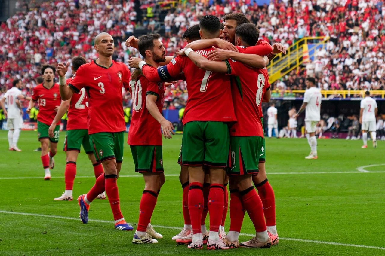 Bruno Fernandes (8) of Portugal celebrate with his teammates after scoring a goal during UEFA EURO 2024 Group F football match between Turkiye and Portugal, Dortmund, June 22, 2024, Anadolu Agency