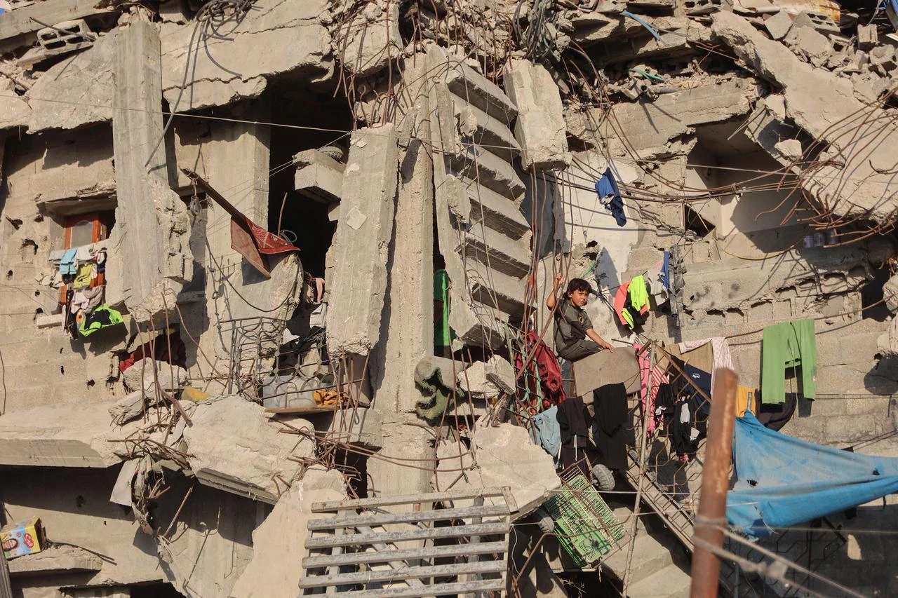 A Palestinian child is seen in the midst of the rubble of destroyed buildings in the Jabalia camp for Palestinian refugees in the northern Gaza Strip on August 2, 2026. (AFP Photo)