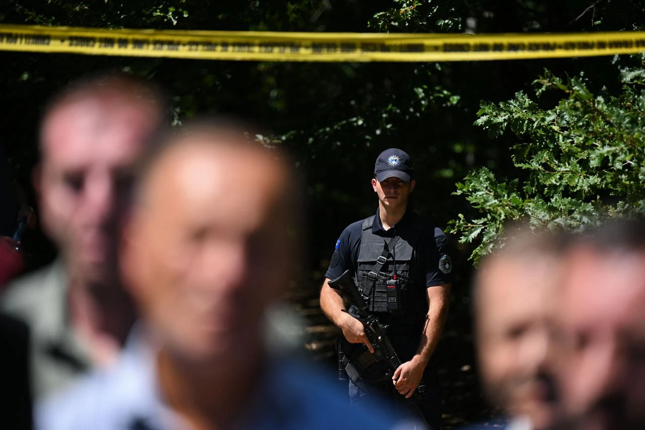 A Kosovo police officer stands near a newly discovered possible mass grave site in the village of Kalluder, near the town of Zubin Potok, on August 1, 2026. (AFP Photo)