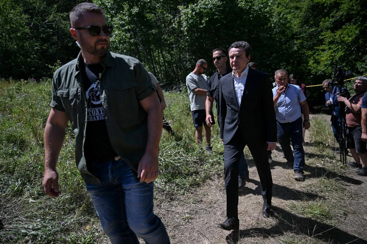 Kosovo's Prime Minister Albin Kurti (C) arrives to near a newly discovered possible mass grave site in the village of Kalluder, near the town of Zubin Potok, on August 1, 2026. (AFP Photo)